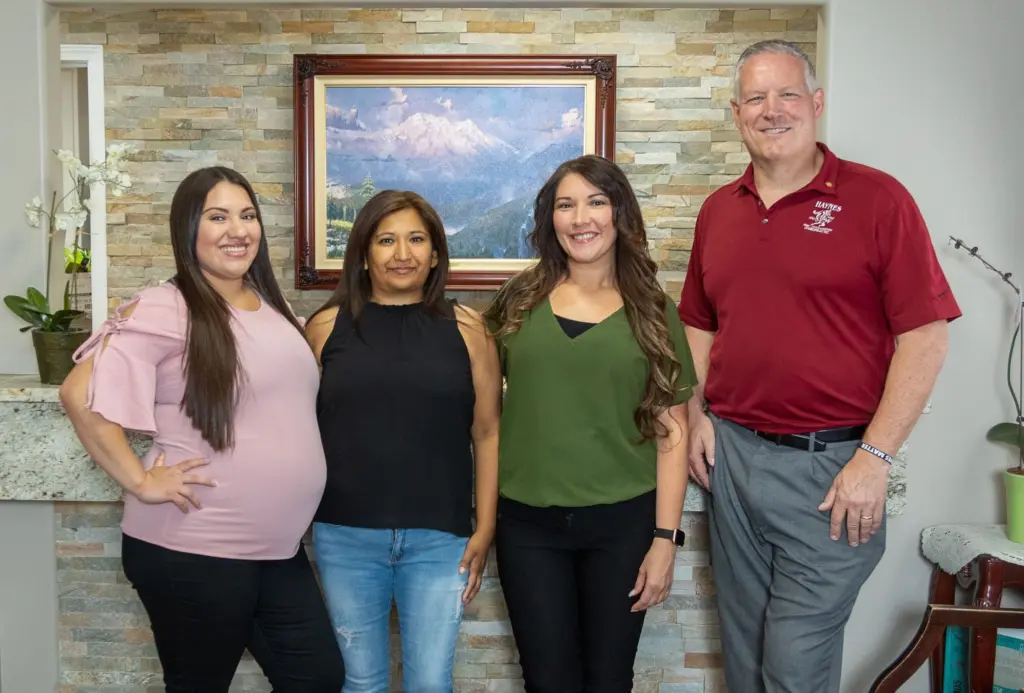 Dr. Jeff Haynes with the Haynes Chiropractic team in the reception area